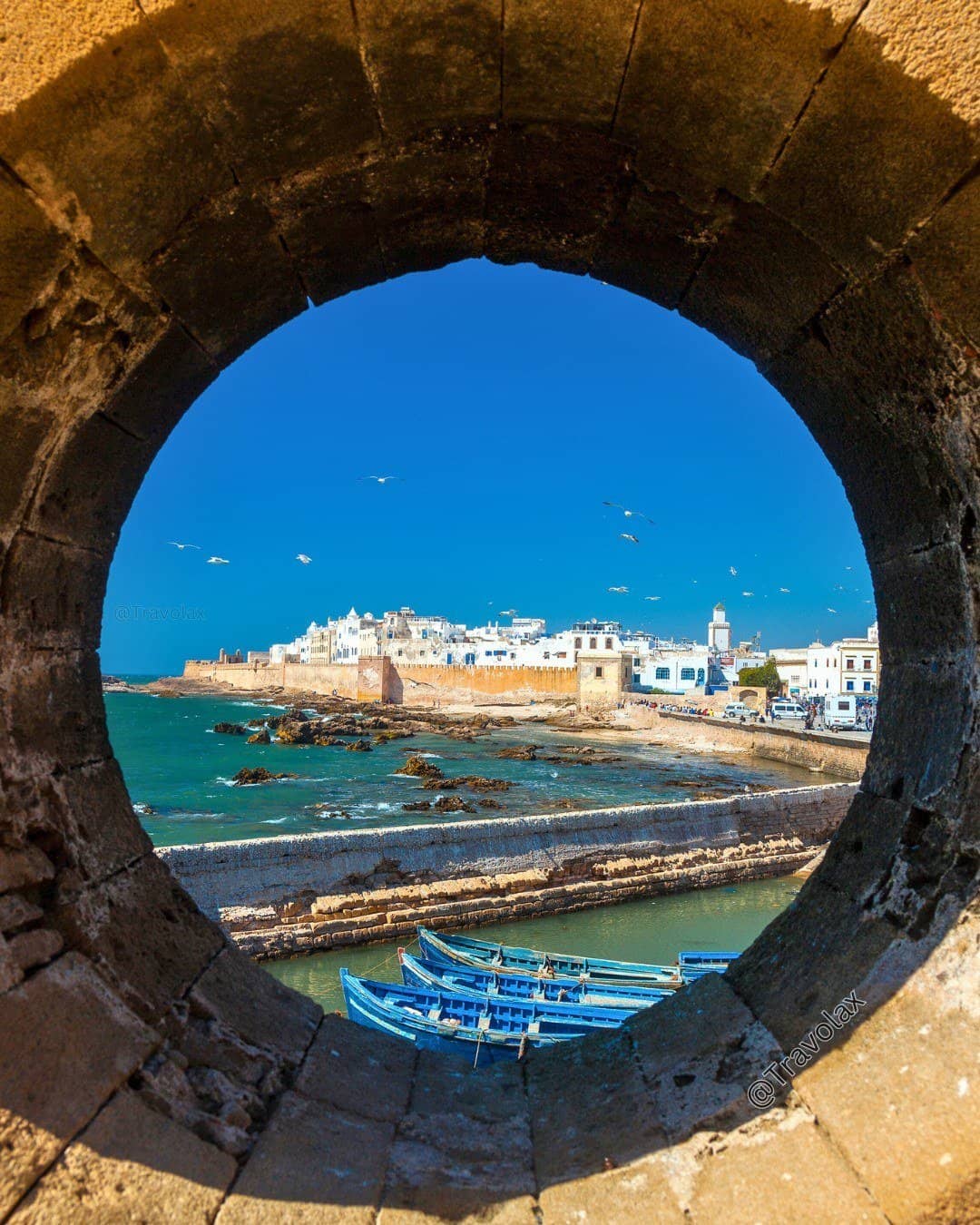 Beautiful view of Essaouira's historic medina, fishing harbor, and Atlantic coastline, a charming stop on a Morocco Itinerary 14 Days
