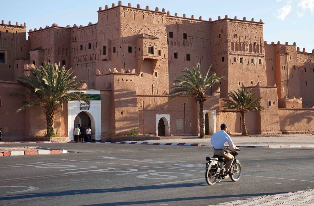 Historic Taourirt Kasbah in Ouarzazate, Morocco, featuring traditional earthen architecture, fortified walls, and intricate Amazigh-inspired design