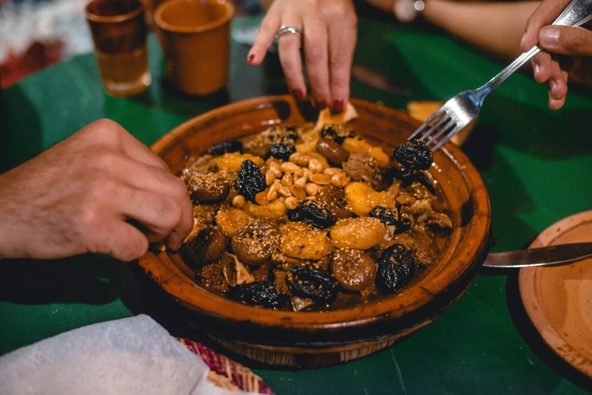 Traditional Moroccan cooking class with tagine and fresh ingredients in Marrakech