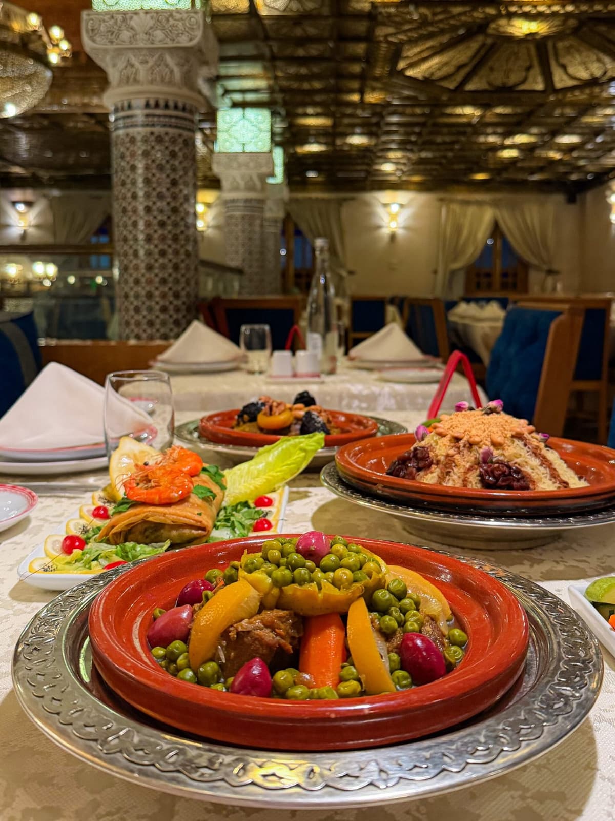 Traditional Moroccan food in Marrakech including tagine, couscous, and local specialties served in an authentic restaurant
