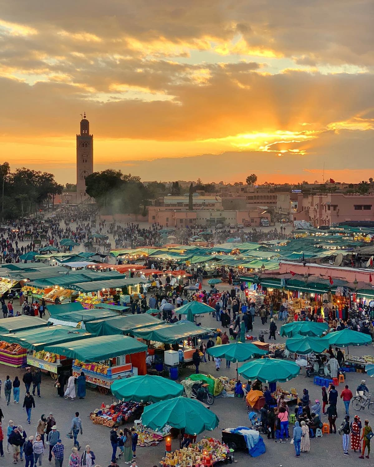 Panoramic view of Jemaa el-Fnaa at sunset, the heart of Marrakech and a highlight of every Marrakech itinerary.