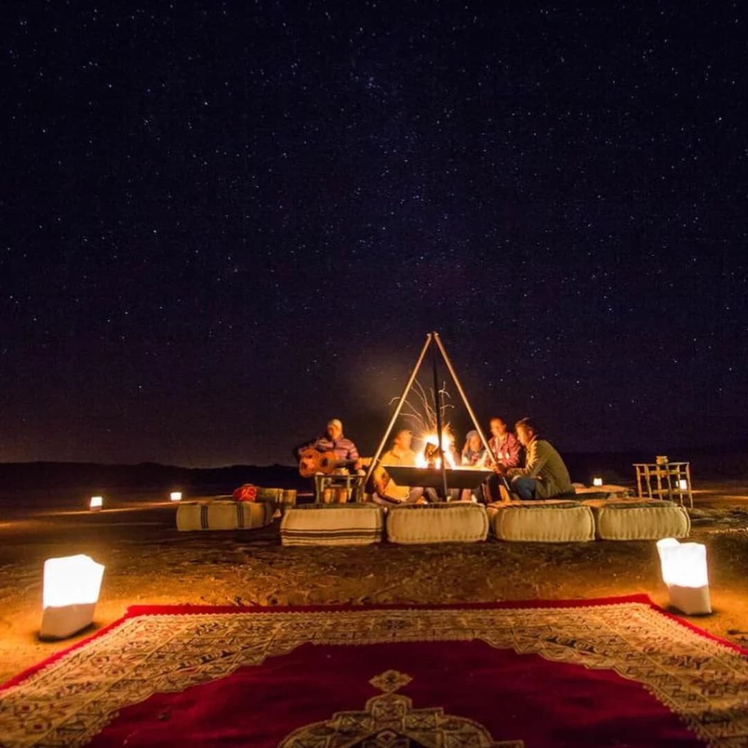Travelers enjoying a Sahara desert camp experience on a Morocco tour