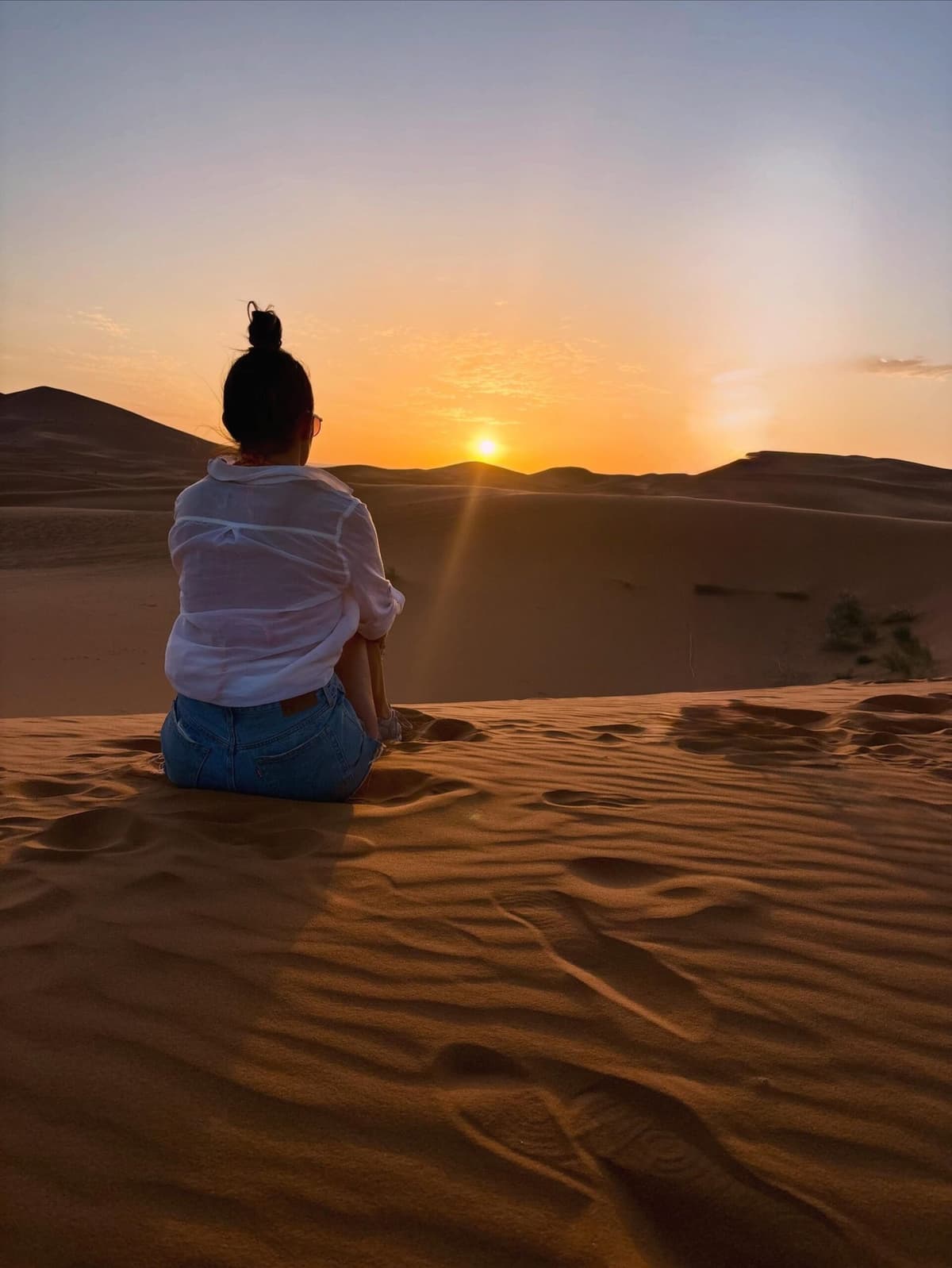 Morocco Sand Dunes glowing golden at sunset in the Merzouga Sahara Desert