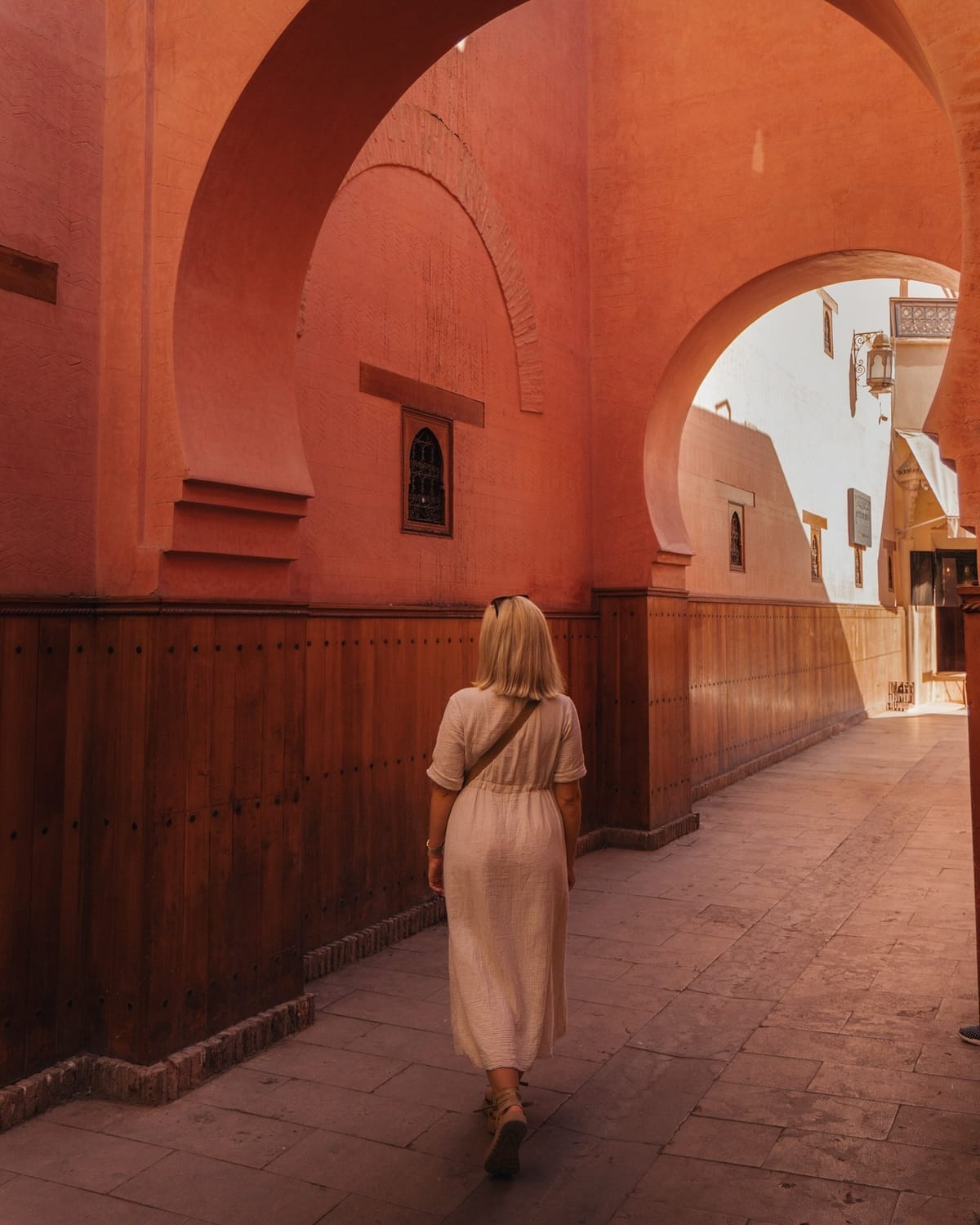 Woman wearing a modest dress while exploring the Marrakech Medina