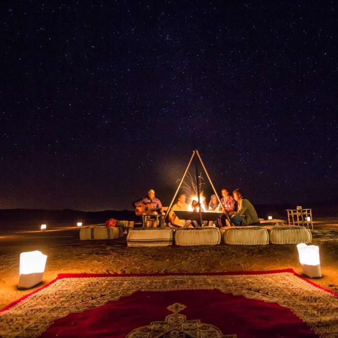 Travelers enjoying a Sahara desert camp experience on a Morocco tour