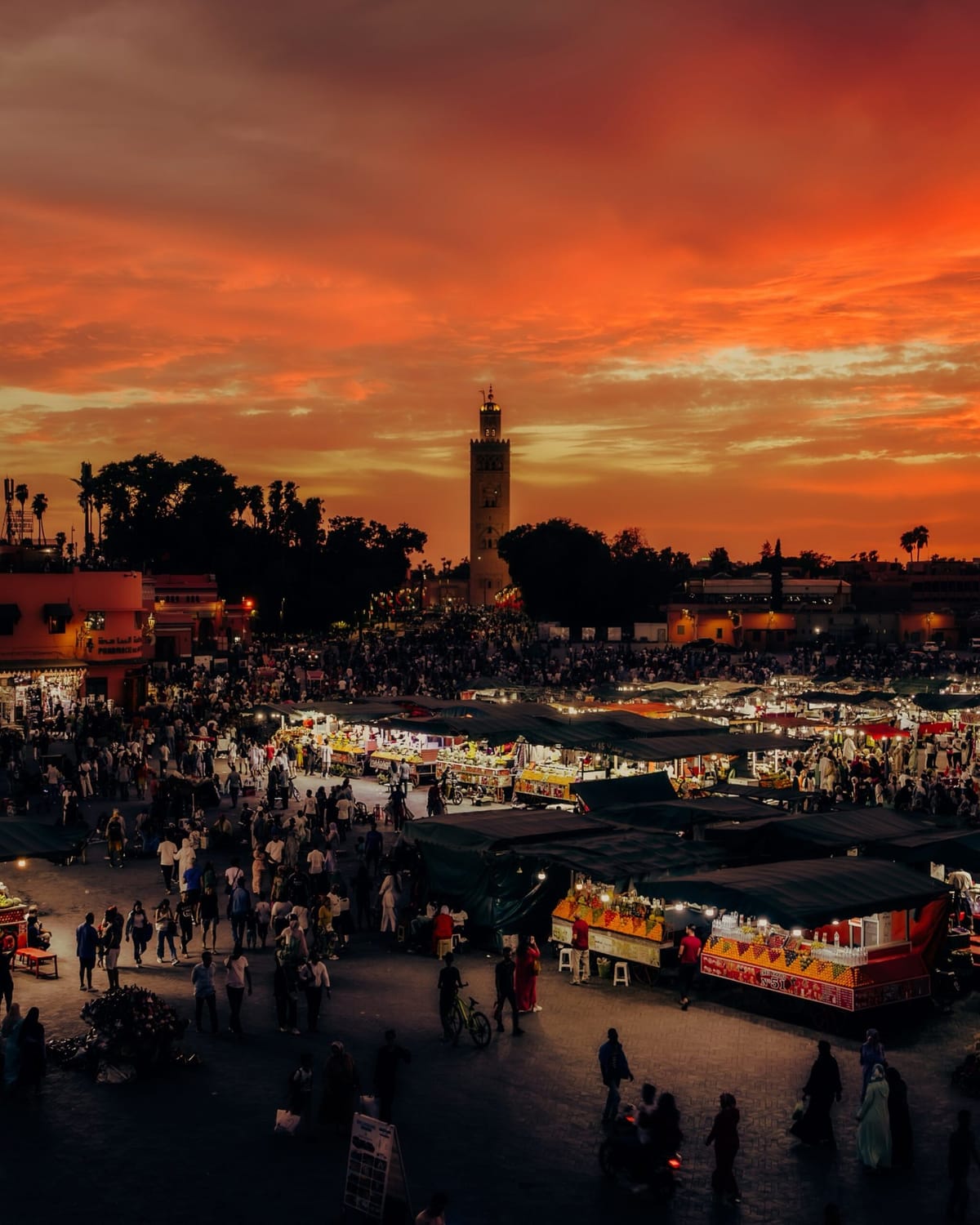 Jemaa el-Fnaa square and Koutoubia Mosque during sunset showcasing Marrakech Nightlife and Marrakech at Nigh
