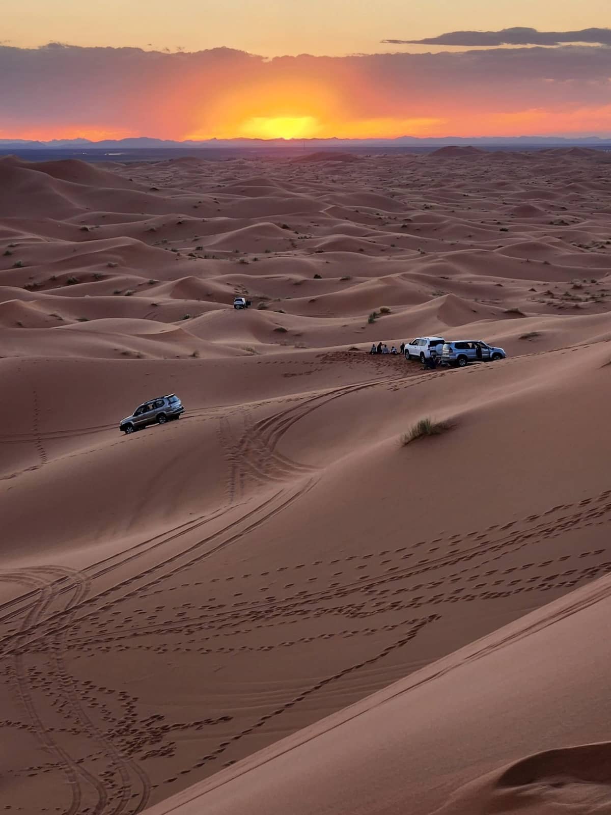 Golden sunset over the Sahara Desert dunes of Merzouga during a 12 Day Morocco Itinerary
