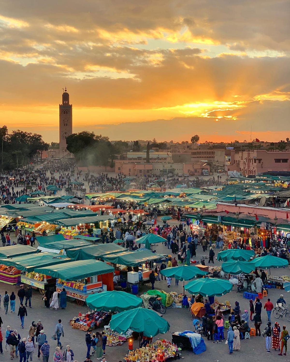 Panoramic view of Jemaa el-Fnaa at sunset, the heart of Marrakech and a highlight of every Marrakech itinerary.