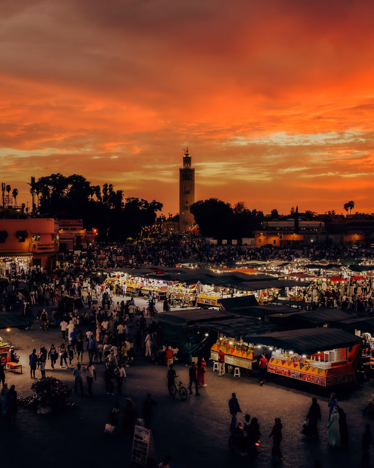 Jemaa el-Fnaa square and Koutoubia Mosque during sunset showcasing Marrakech Nightlife and Marrakech at Nigh